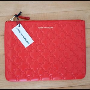COMME DES GARÇONS clover embossed pouch